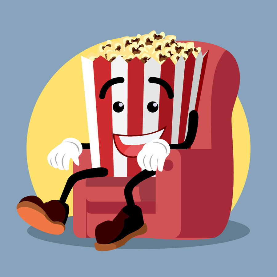 Bæger med popcorn med ansigt på sidder i en stol 